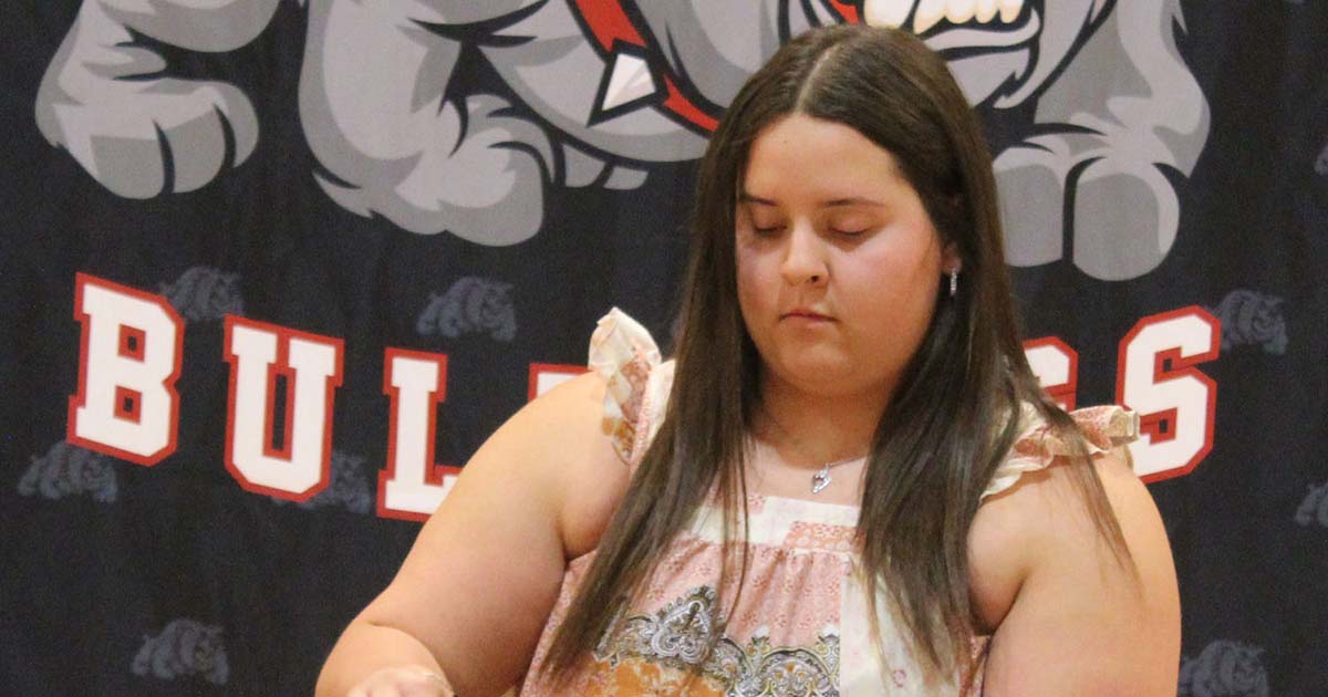A Golden Plains High School senior participating in a National Honor Society candle ceremony